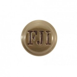 Green metal cockade with FJI monogram. 31 mm